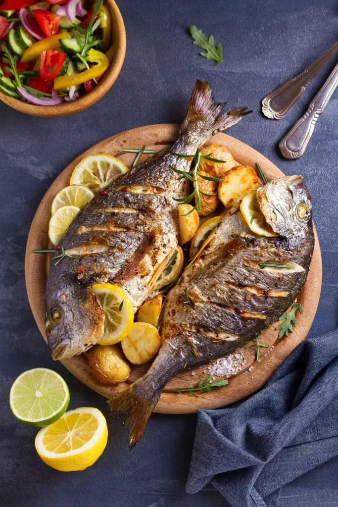 Fresh grilled fish served at a seaside taverna in Crete, Greece