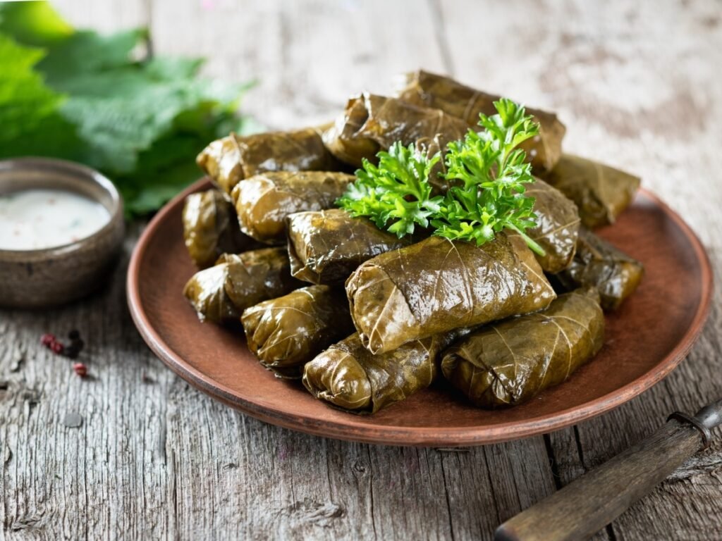 Traditional Greek dolmadakia – vine leaves stuffed with rice, olive oil, and herbs, served in Crete